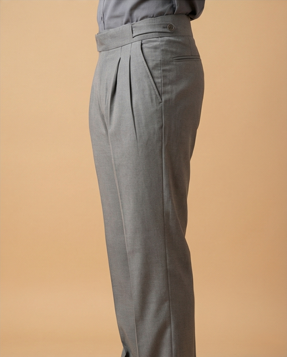 Gray pleated pants on a beige background